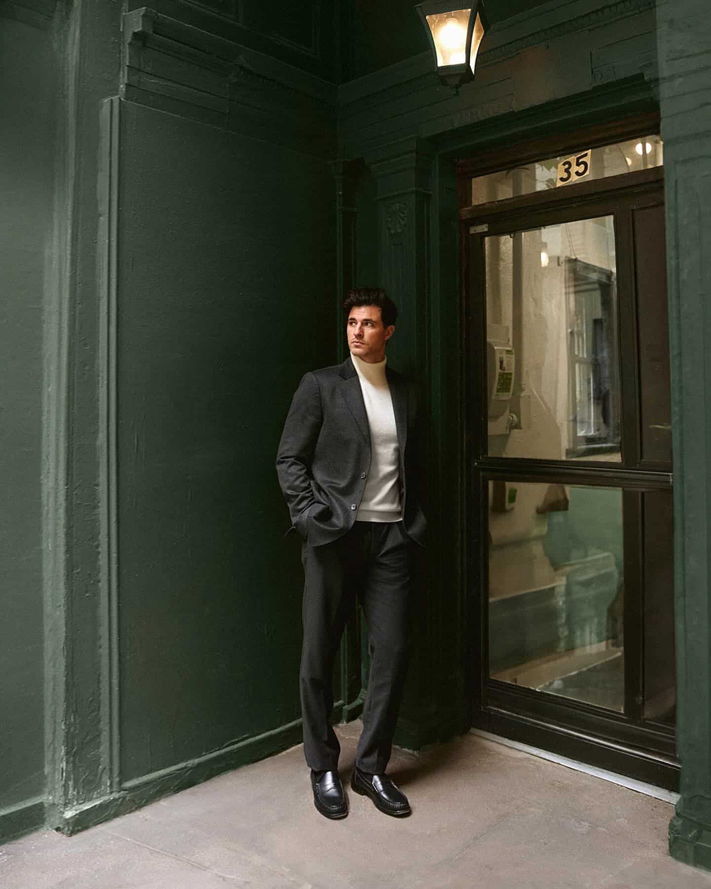 man standing by the door wearing a cashmere blazer
