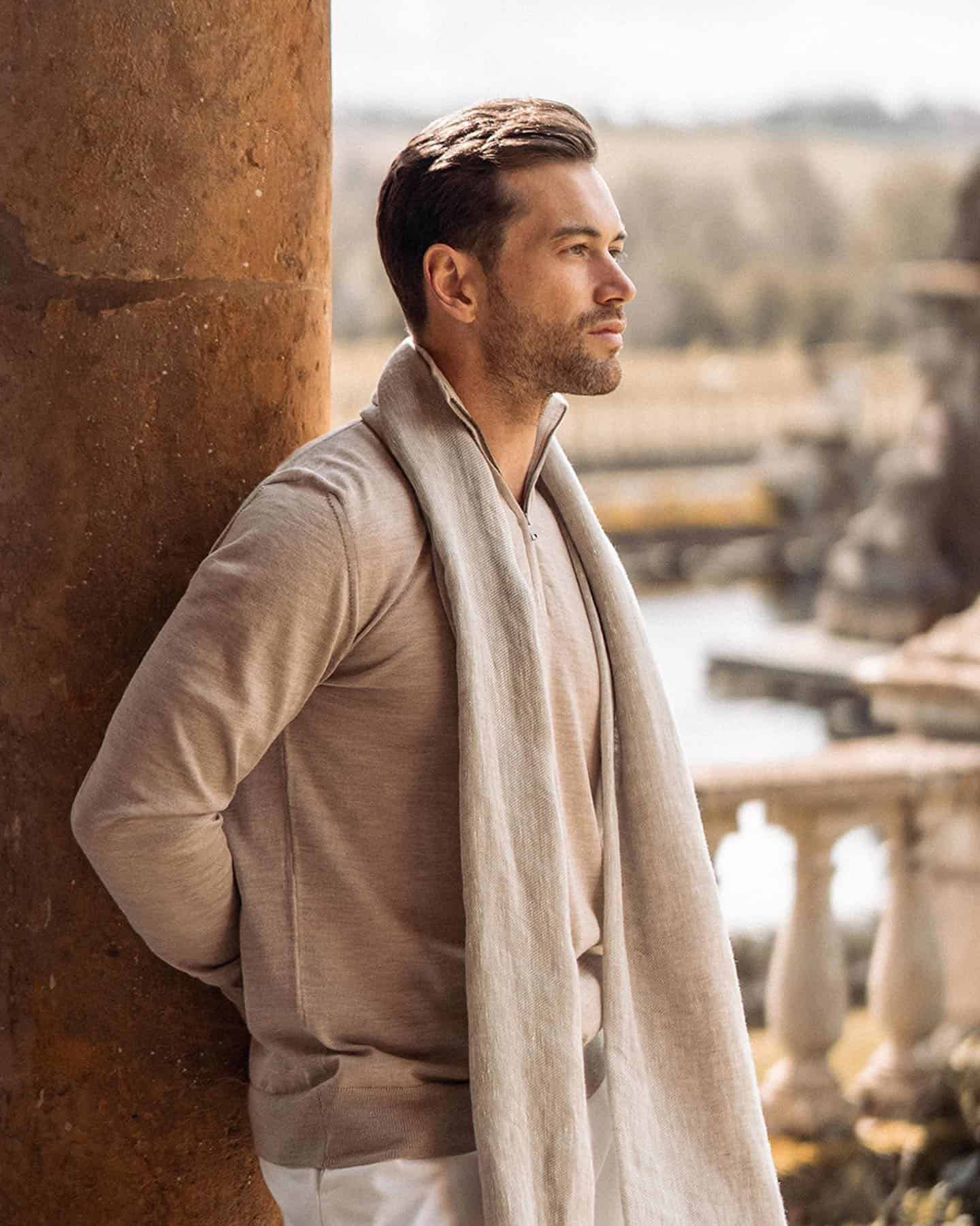 man wearing a silk-cashmere blend zip-up sweater and scarf