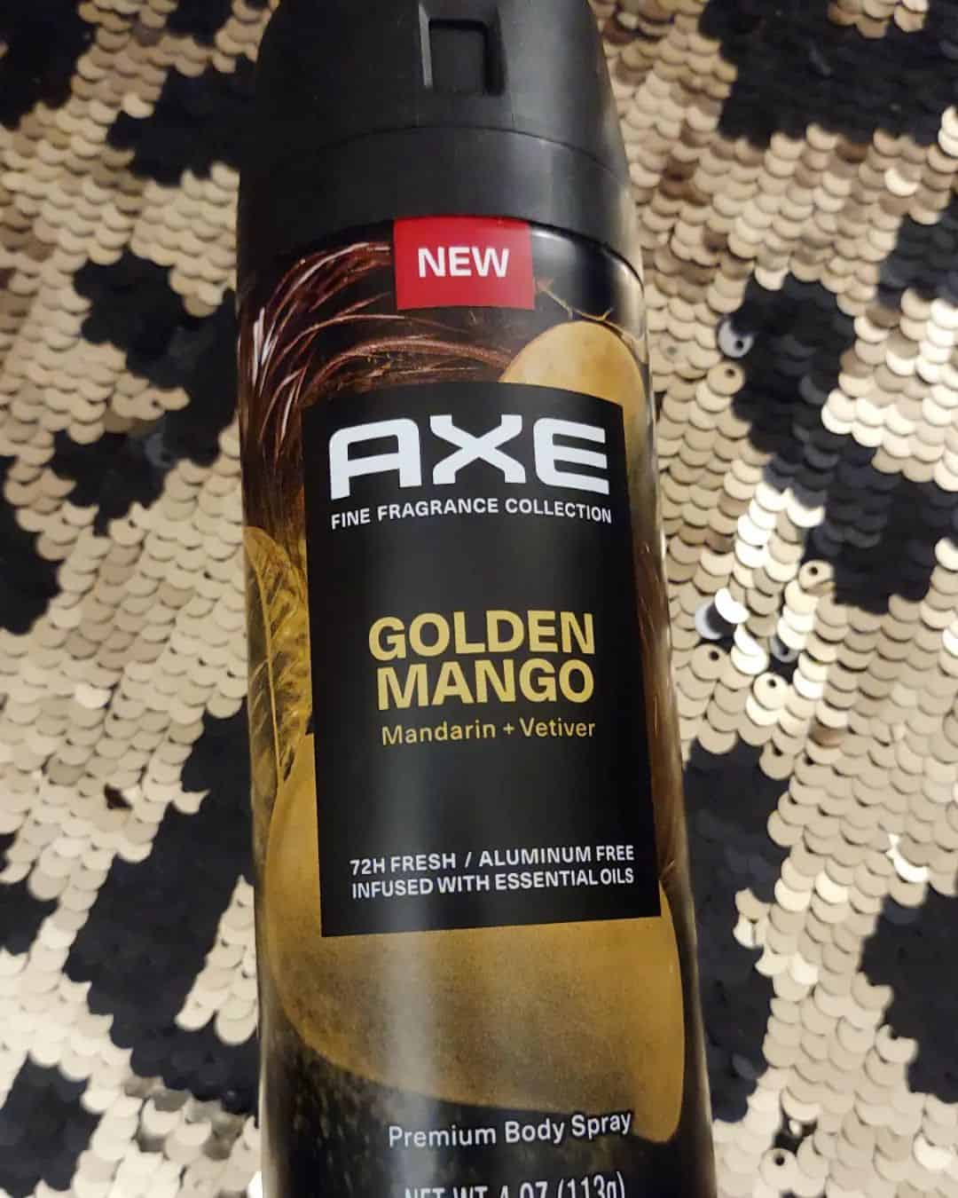 a bottle of axe golden mango body spray