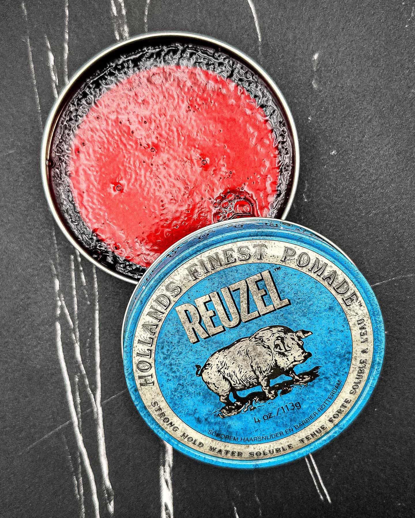 an open container of the reuzel blue pomade