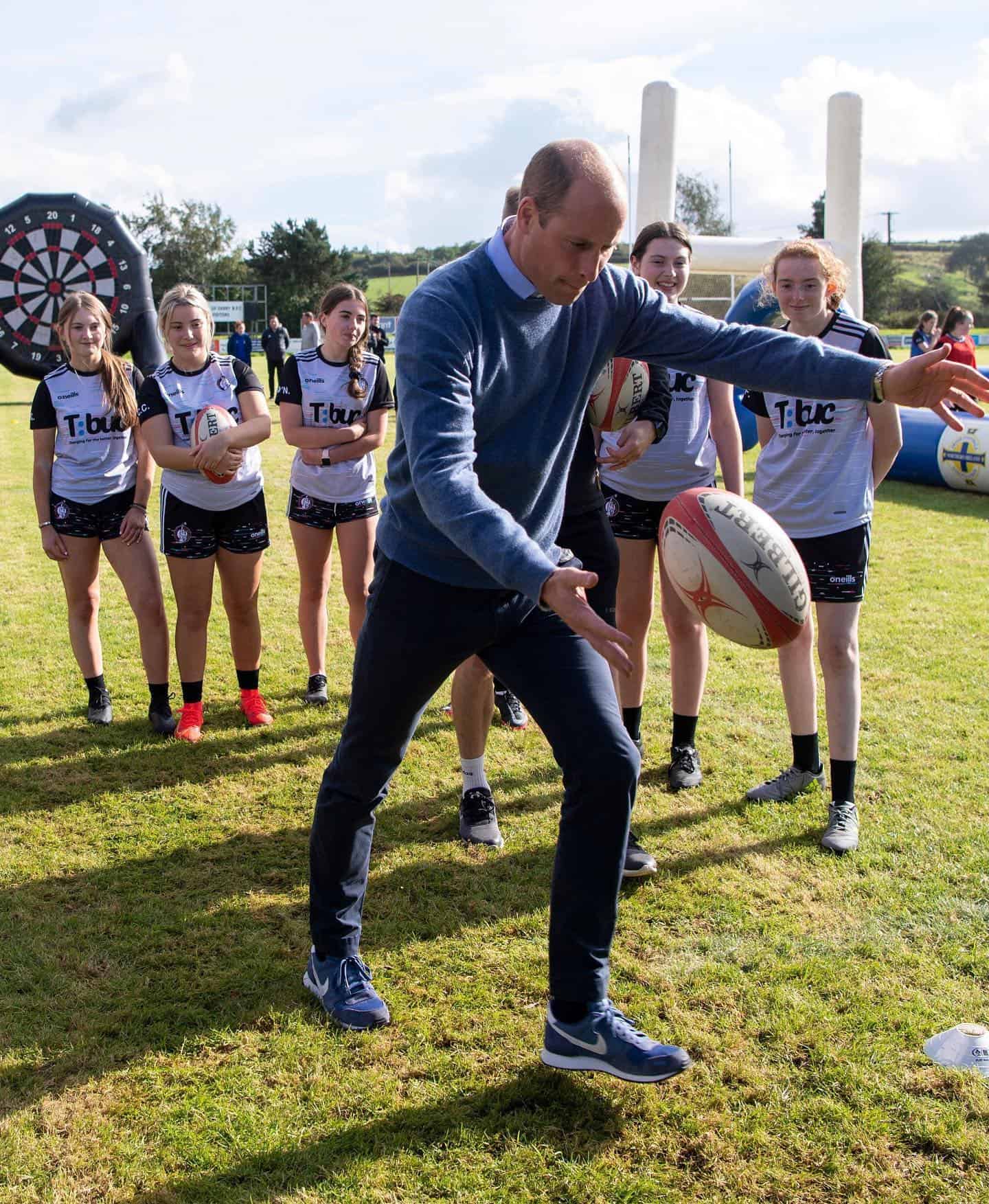 Prince William about to kick a rugby ball