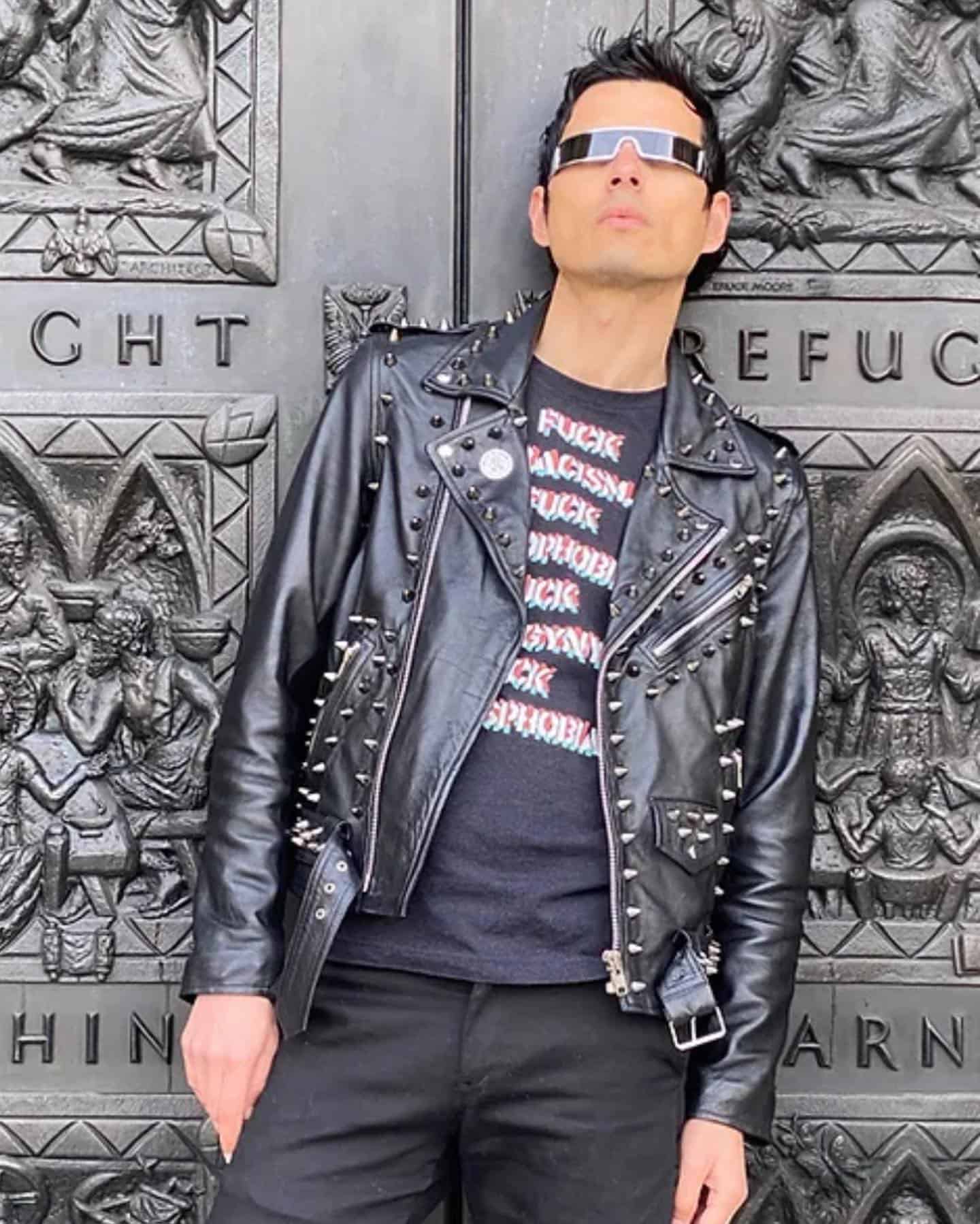 man in leather jacket wearing a futuristic sunglasses