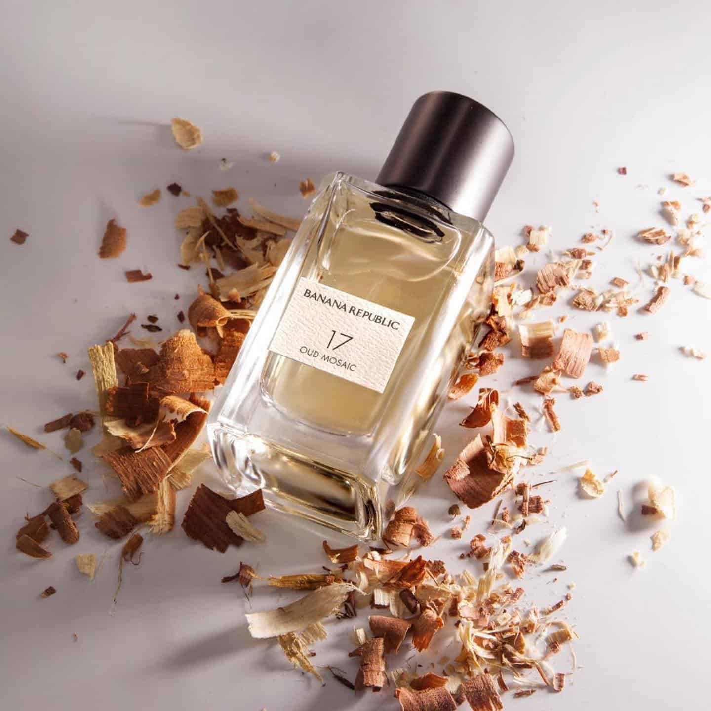 a bottle of 17 oud mosaic by banana republic surrounded with wood shavings
