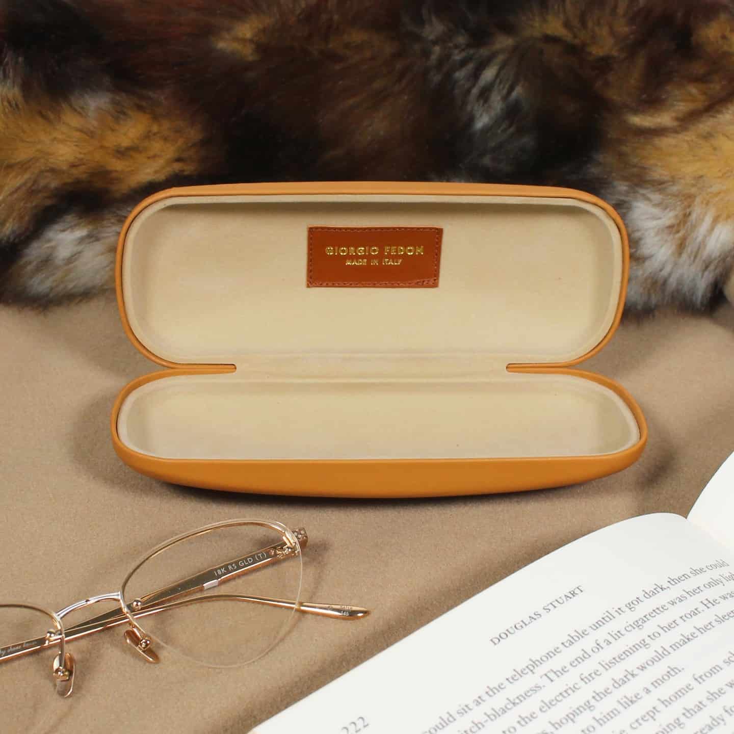 a leather hard shell glasses case
