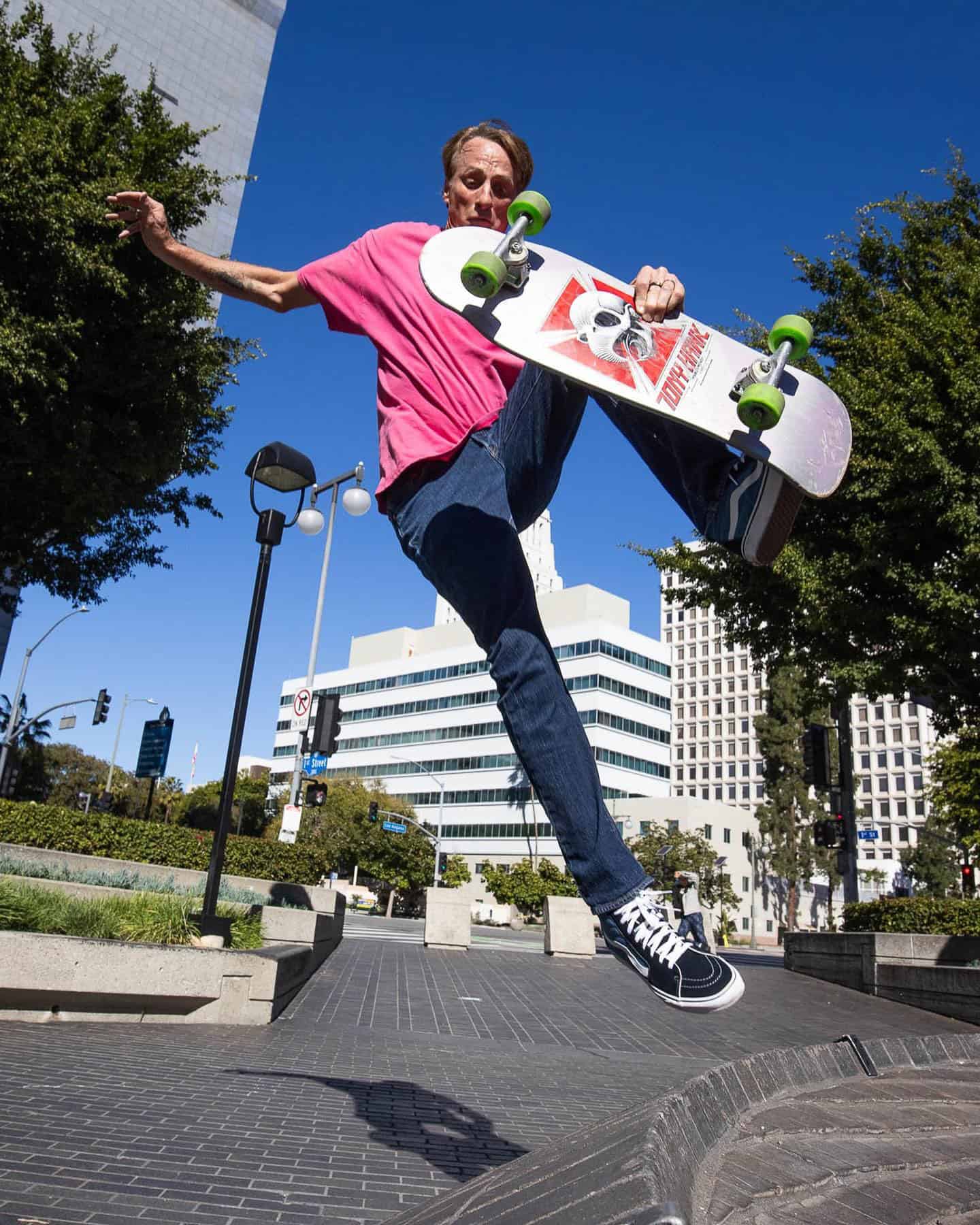 tony hawk performing a trick with a skateboard