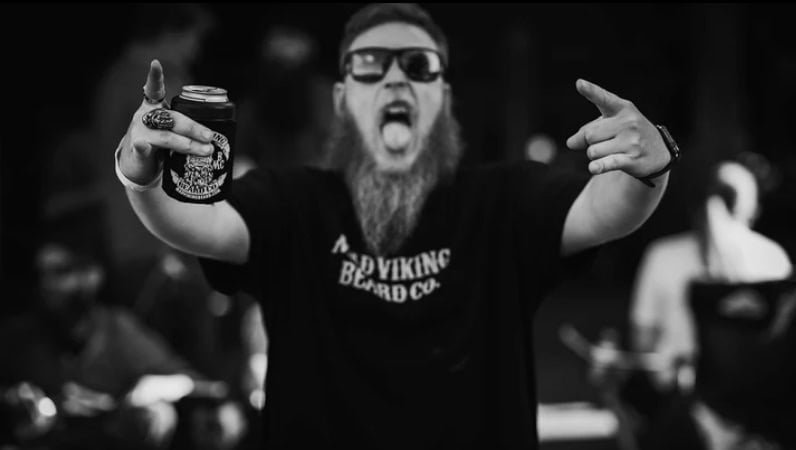 Man wearing Mad Viking shirt with arms up