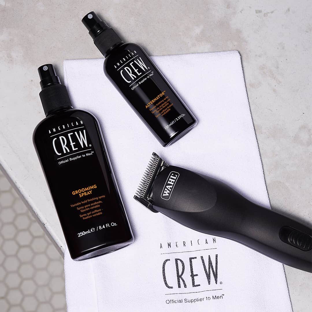 a bottle of grooming spray and alternator by american crew and a wahl clipper
