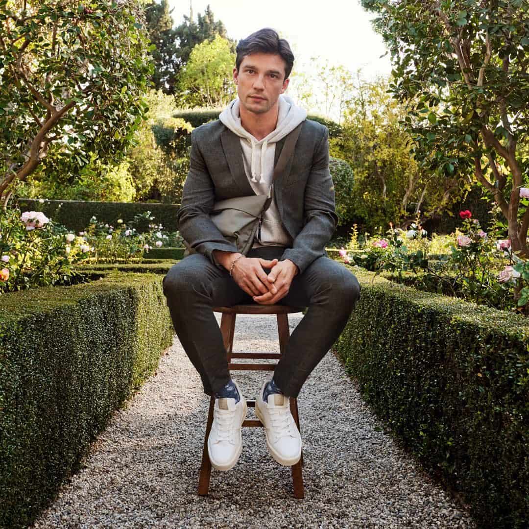 man in the garden sitting on a stool