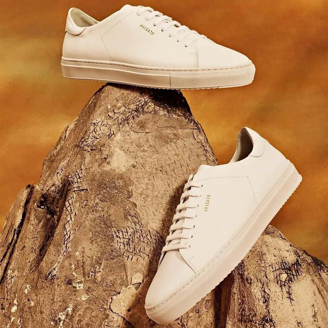 a pair of clean 90 sneakers by axel arigato