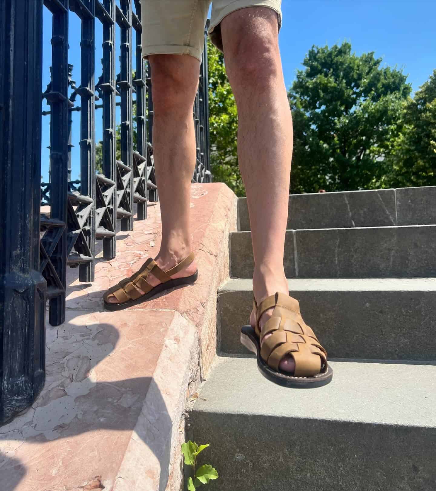man standing on the stairs wearing a closed toe sandals