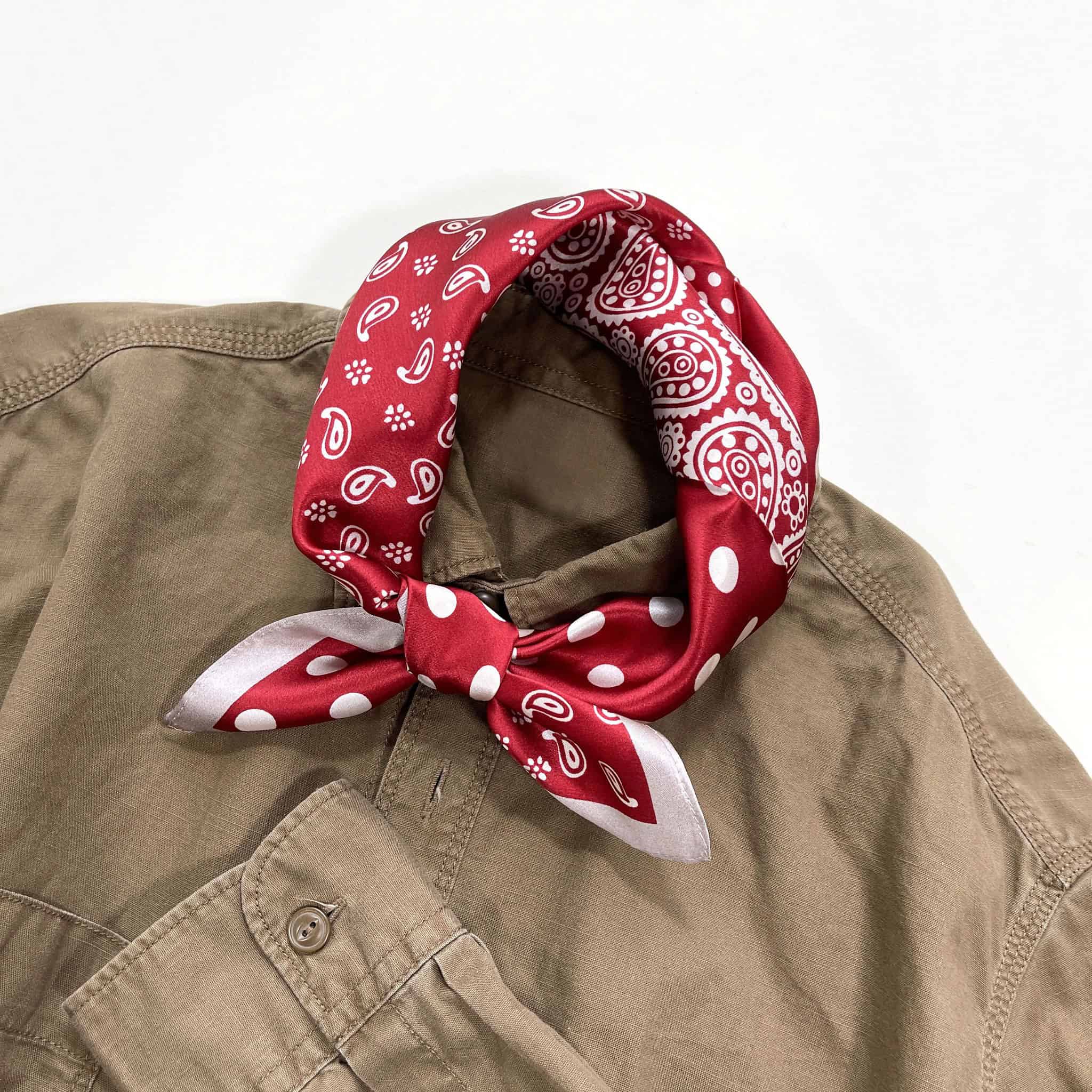 printed red scarf paired with a brown shirt