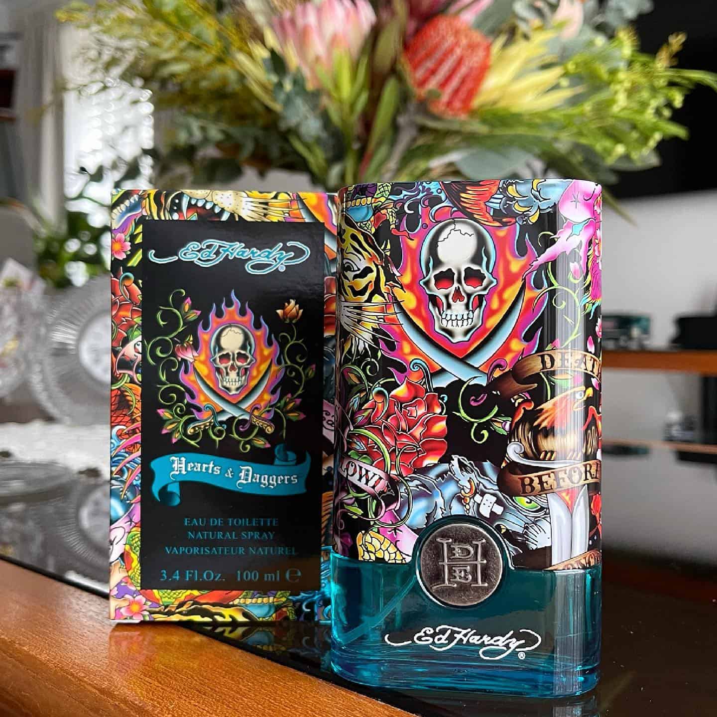 a bottle of hearts and daggers cologne by Ed Hardy with container box