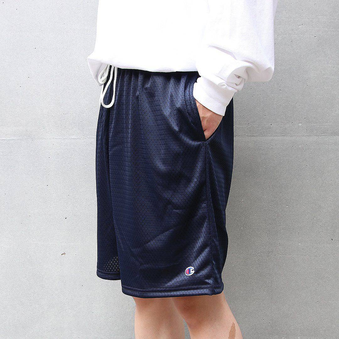man wearing a champion mesh shorts