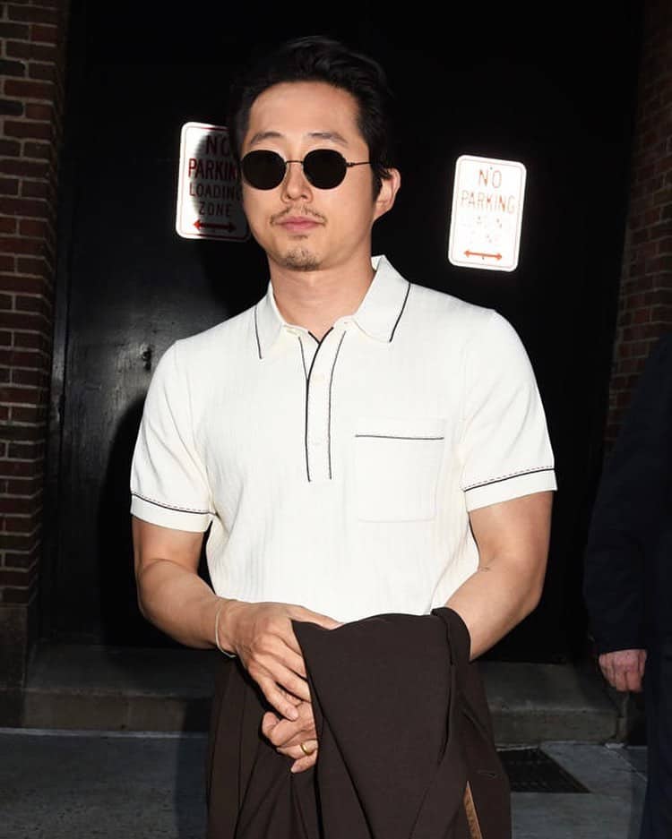 man with sunglasses wearing the todd snyder riviera sweater polo