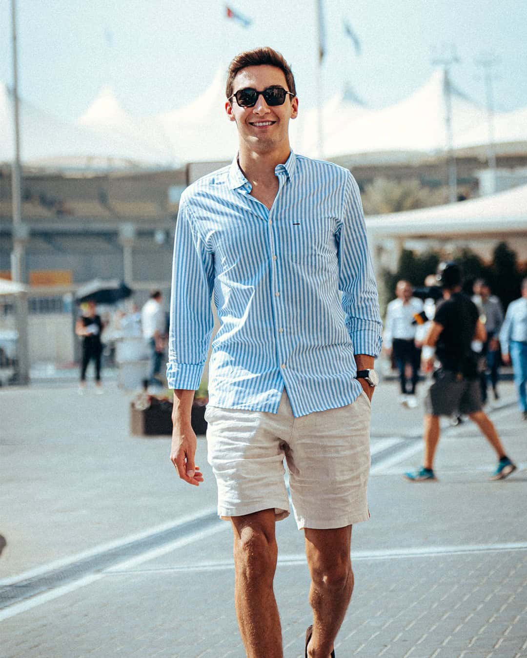 man with sunglasses wearing linen shirt and shorts