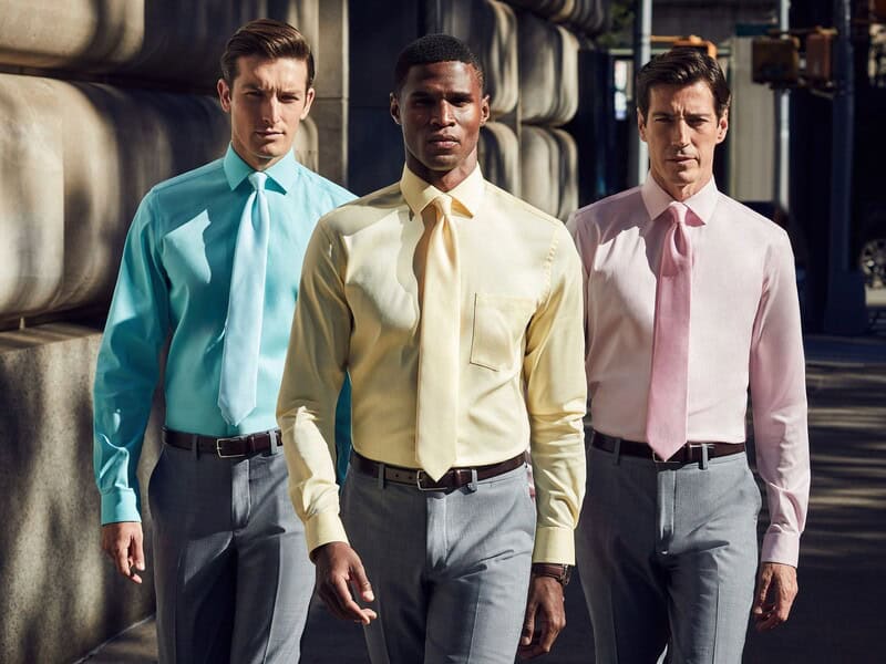 three men in dress shirts with ties
