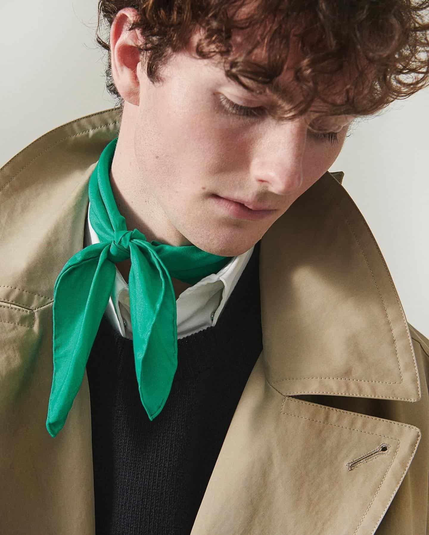 man wearing a green scarf