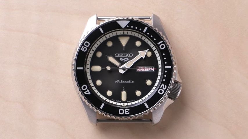 A Seiko 5 watch with no straps
