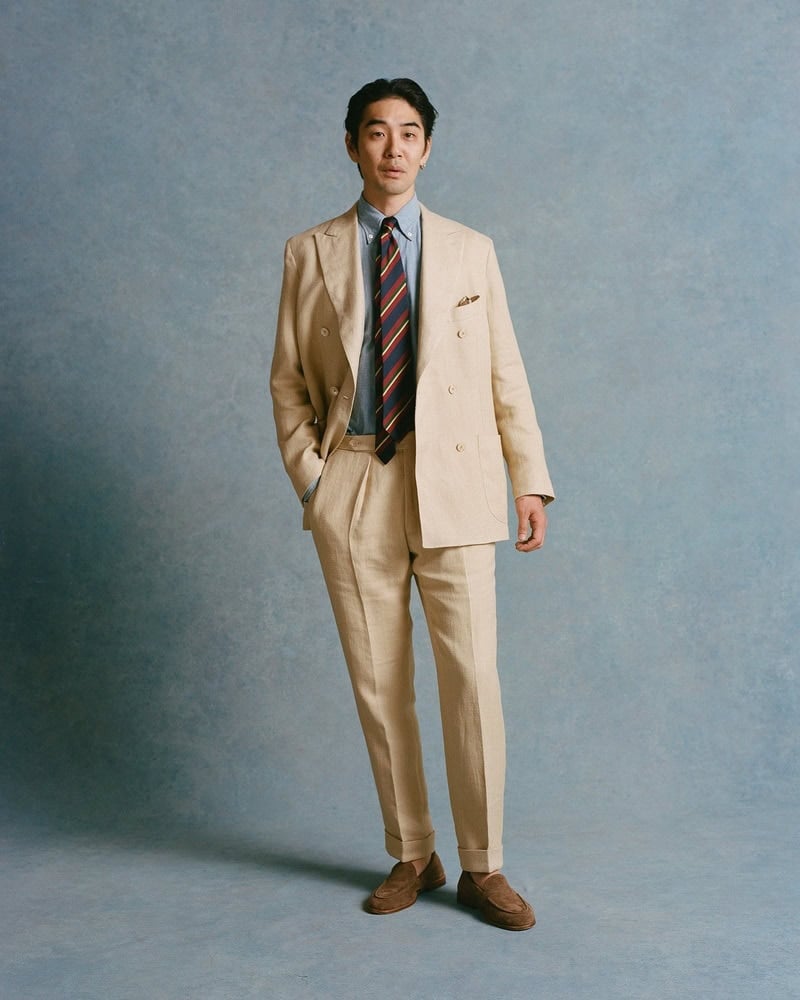 man wearing a linen suit by Drakes