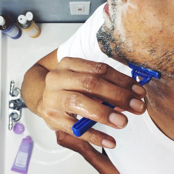 man using the dr bronners organic soap