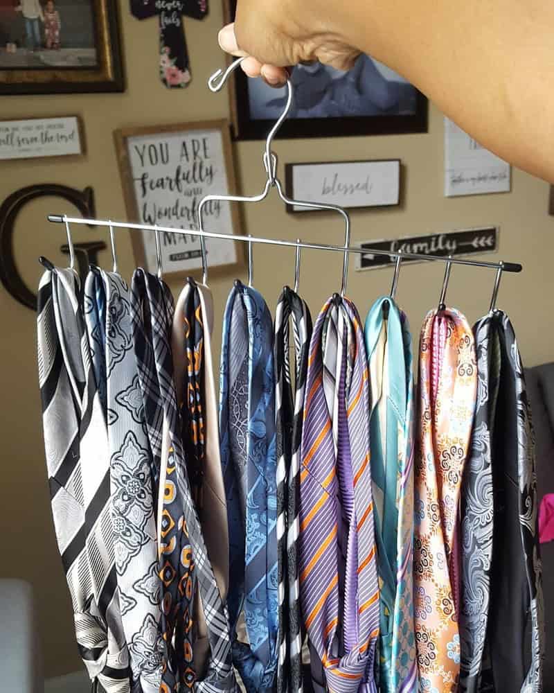 holding a collection of ties on a tie hanger