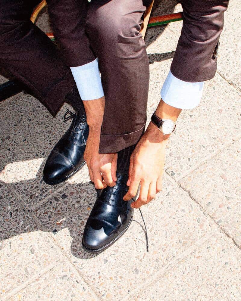 Tying a shoelace of a Myrqvist Oxford shoe