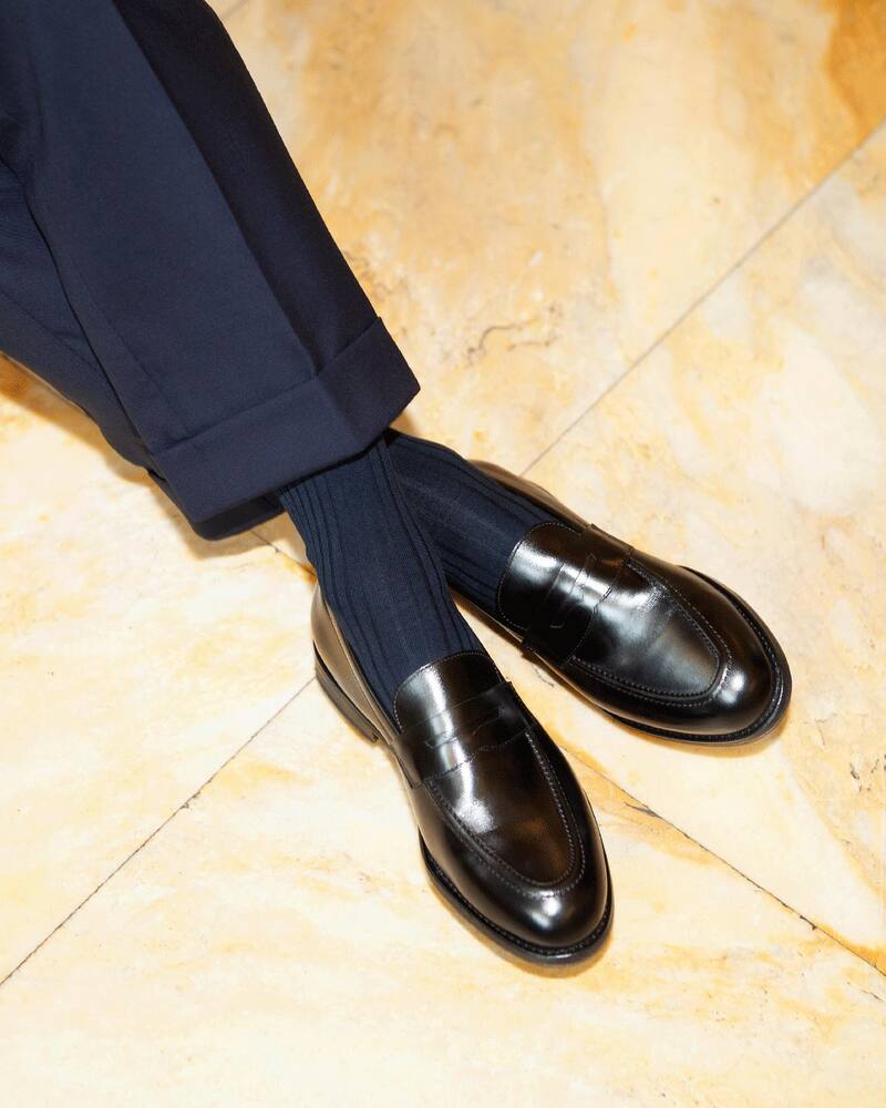 wearing a pair of myrqvist penny loafers