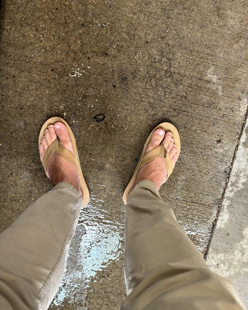 man walking around Pittsburgh in a pair of rainbow sandals