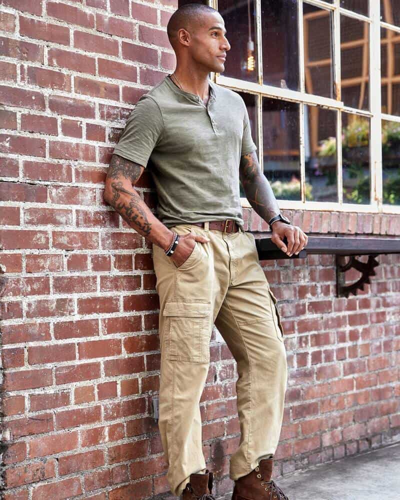 man wearing a henley t-shirt and cargo pants