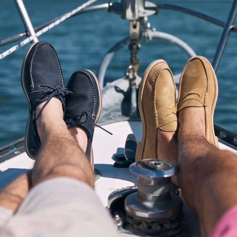 a black suede boat shoes and brown suede loafers by Allen Edmonds