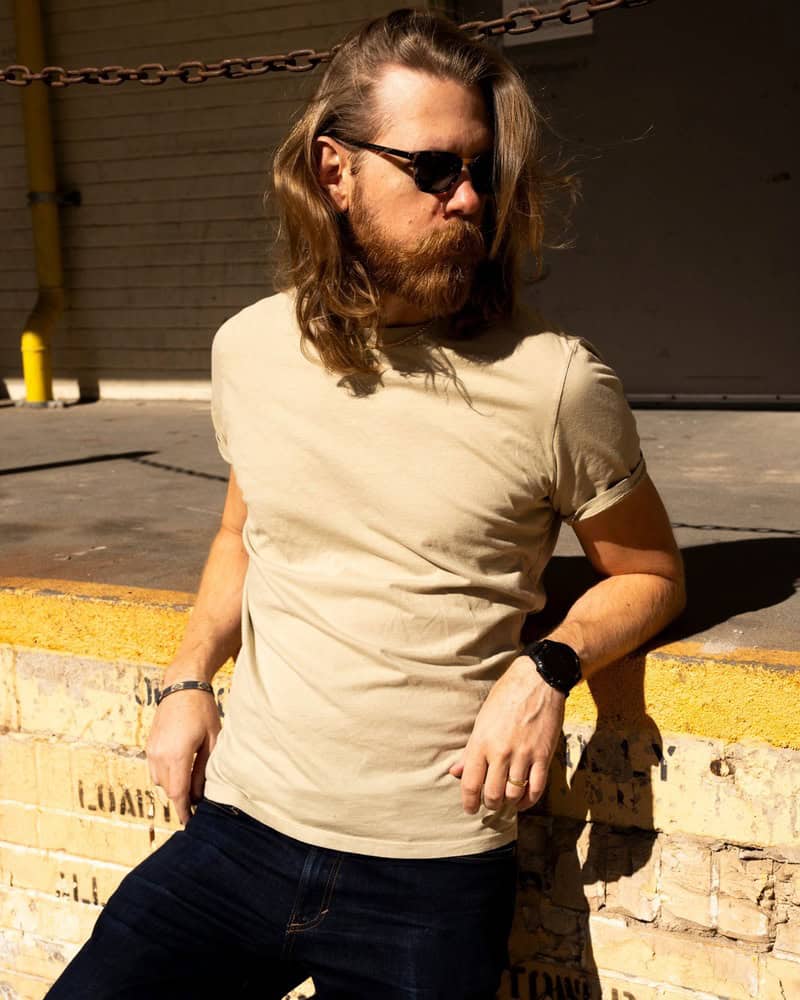 man with silky long hair andbeardwearingsunglasses