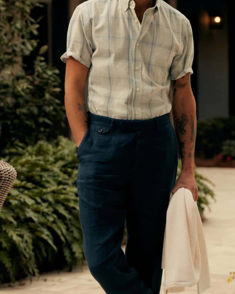 man wearing the flat front twill trousers by Billy Reid