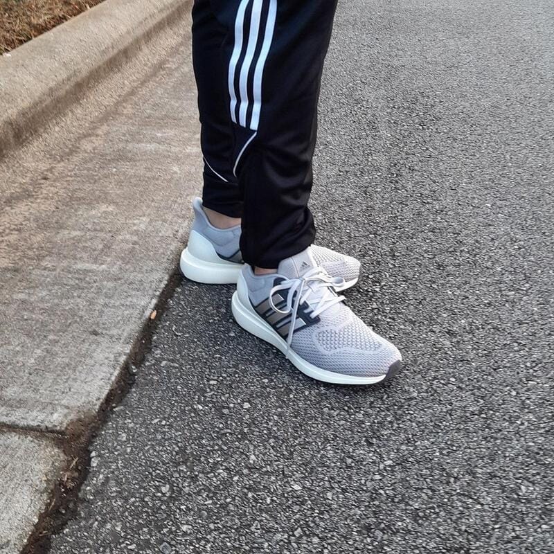 wearing a pair of grey Ubounce sneakers by Adidas