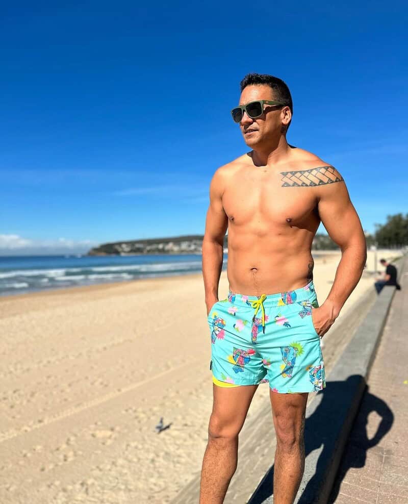 man at the beach wearing shorts with compression liner by Maamgic