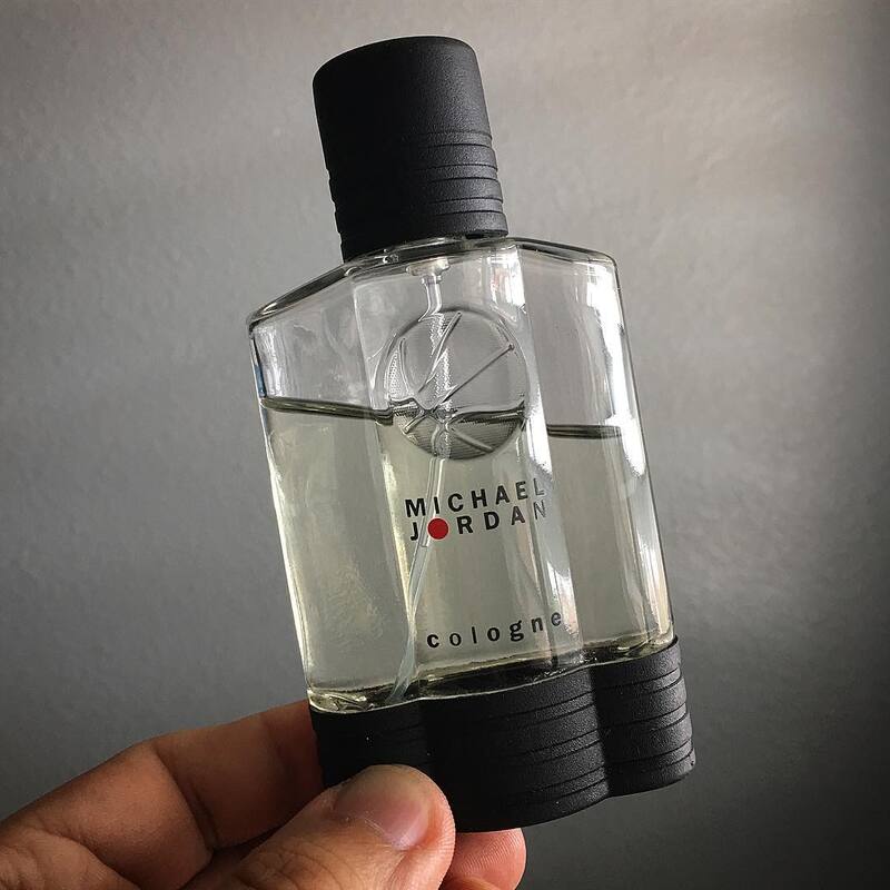 holding a bottle of michael jordan cologne by michael jordan