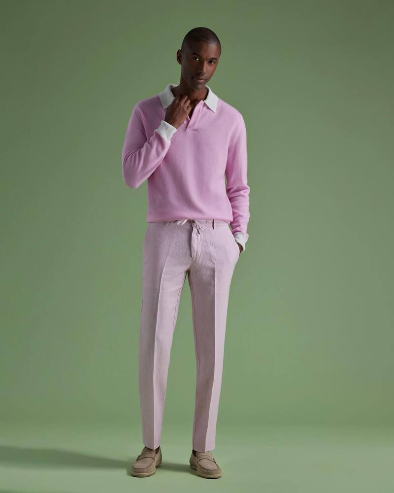man in a cashmere polo shirt and linen drawstring pants