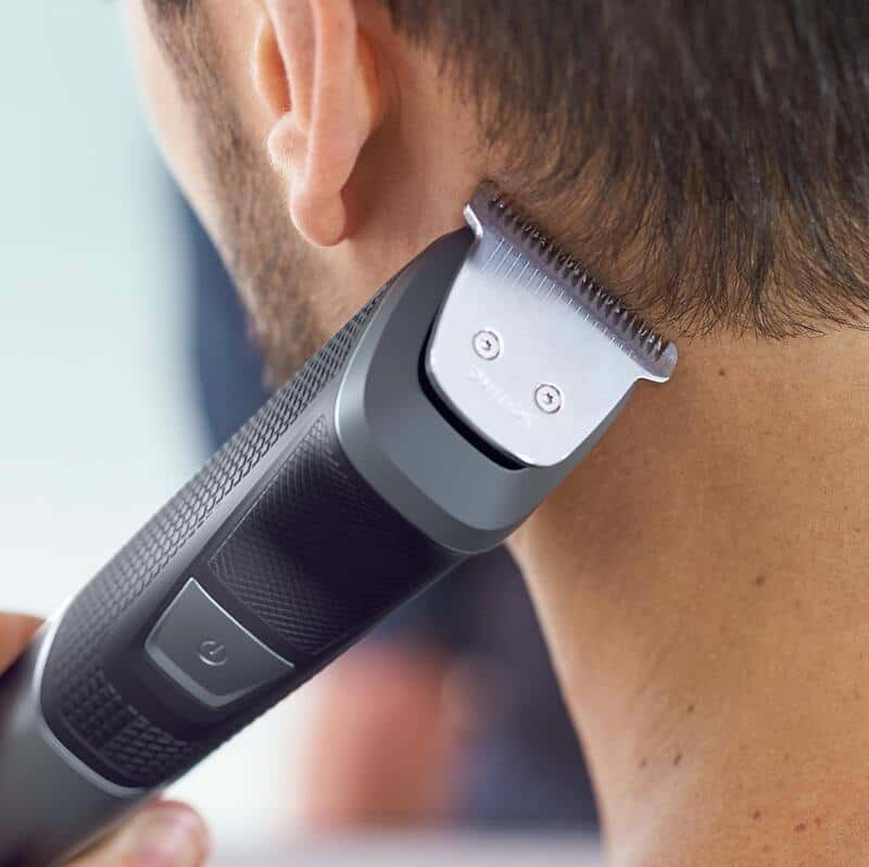 man using a philips norelco multigroomer