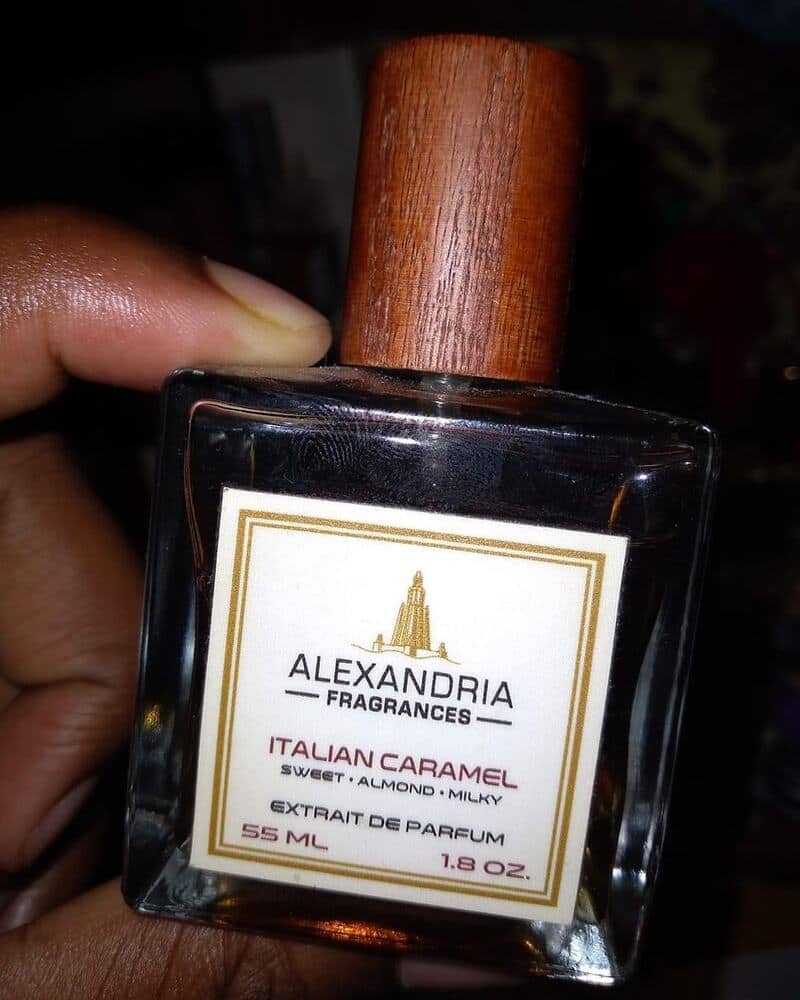 holding a bottle of Italian Caramel Cologne by Alexandria Fragrances