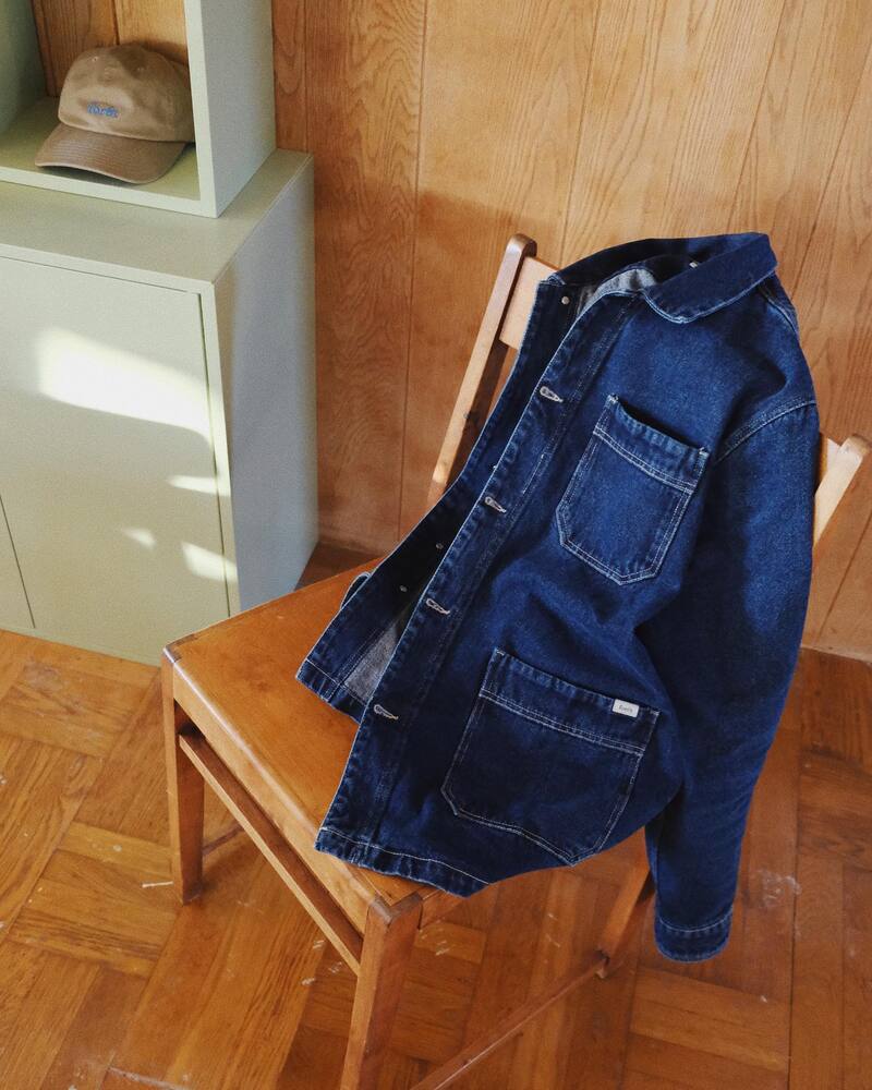 a denim overshirt on a chair