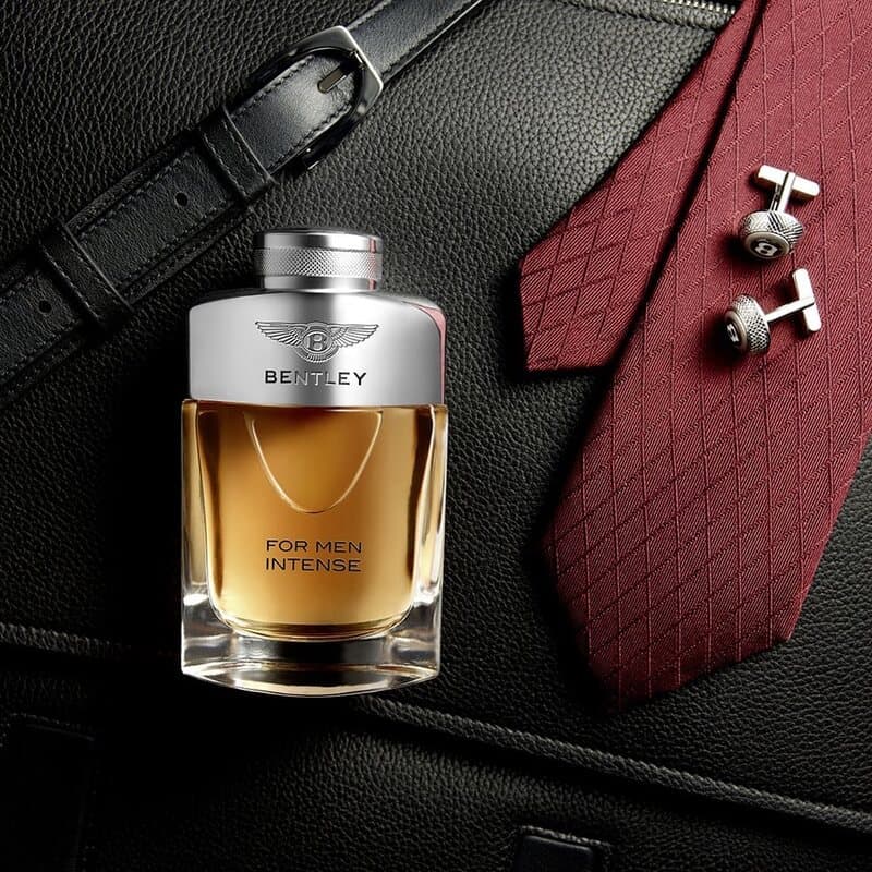 a bottle of bentley intense for men cologne and cufflink and a tie