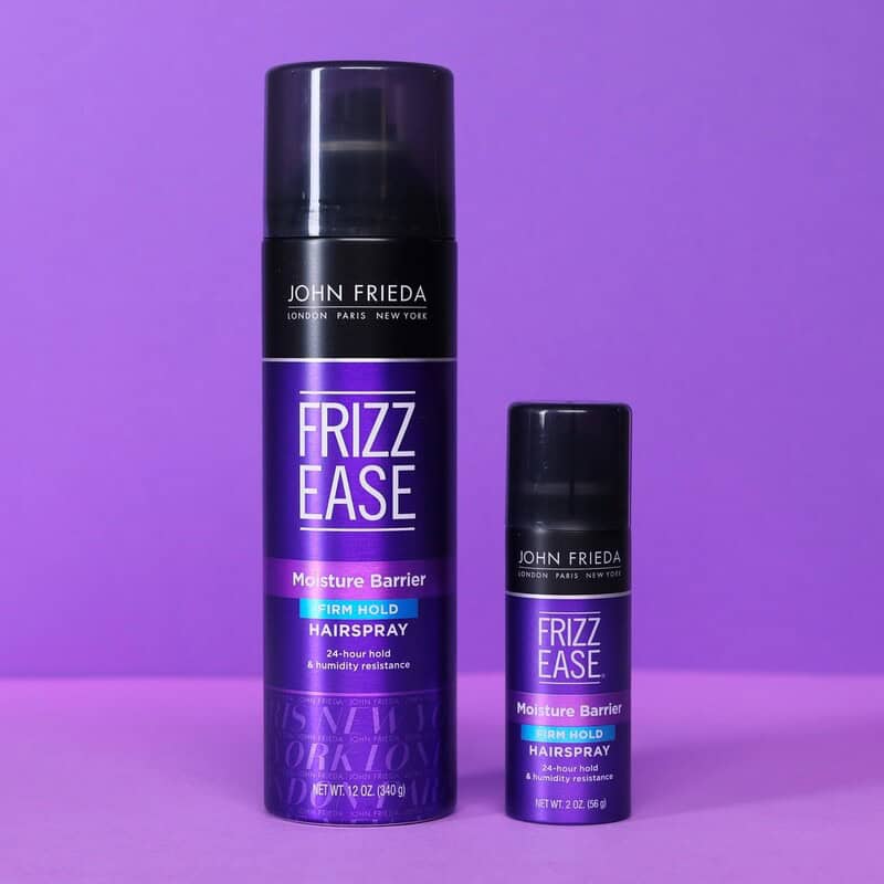 bottles of Frizz Ease Moisture Barrie Hair Spray by John Frieda