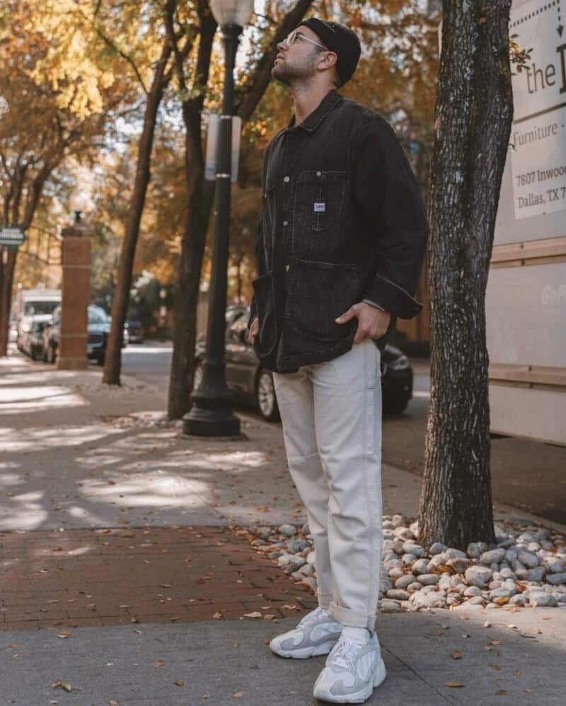 man wearing a black lee denim jacket and beanie