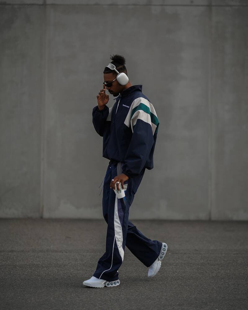 man in a track suit wearing a pair of Nike Air Max DN