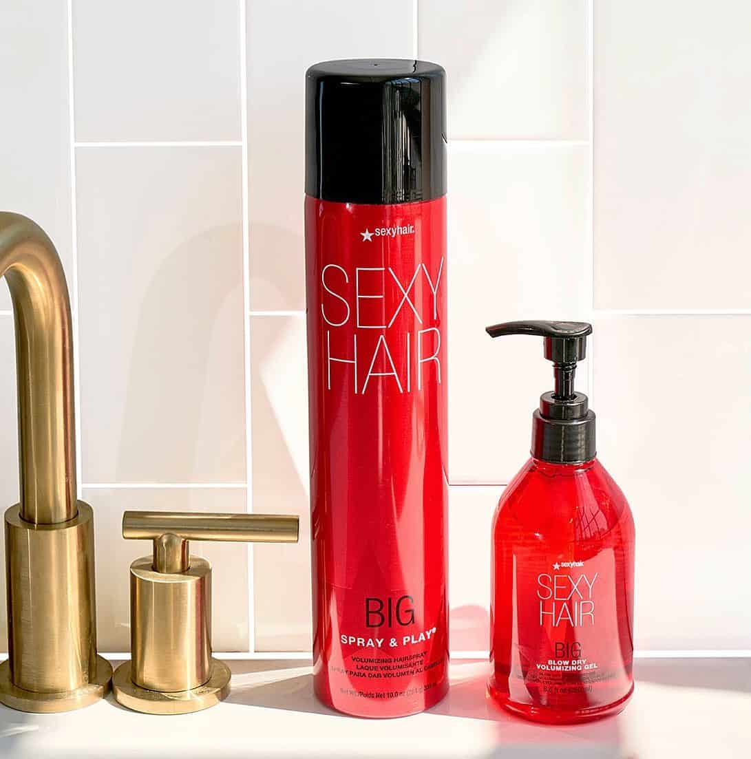 bottles of Sexy Hairspray and Volumizing Gel on a sink