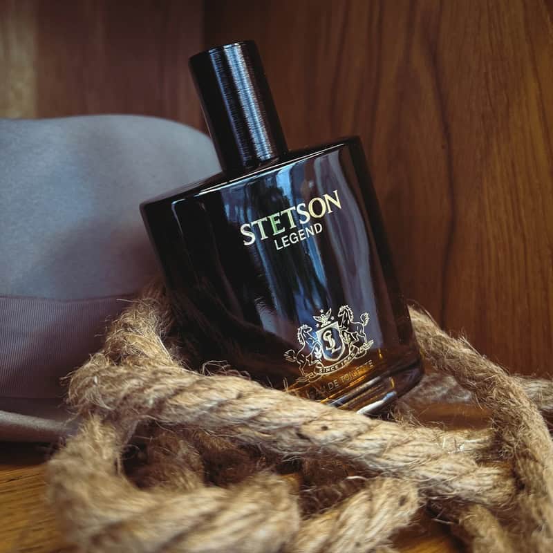 a bottle of Stetson Legend Cologne on top of a rope