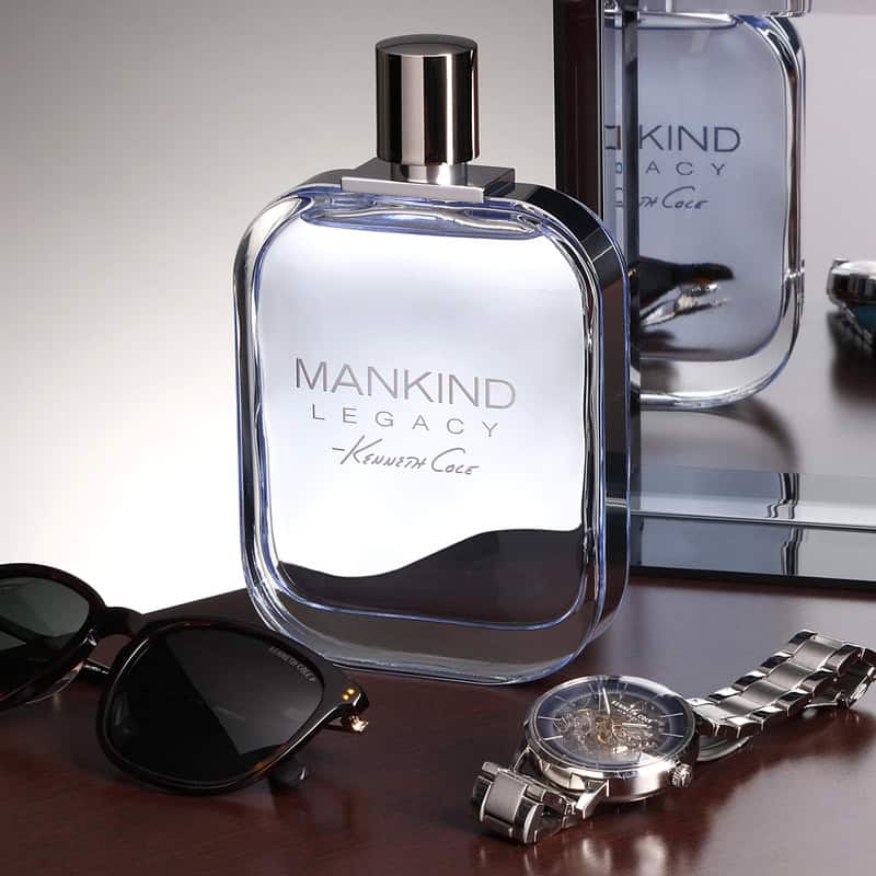 mankind legacy with watch shades beside a mirror