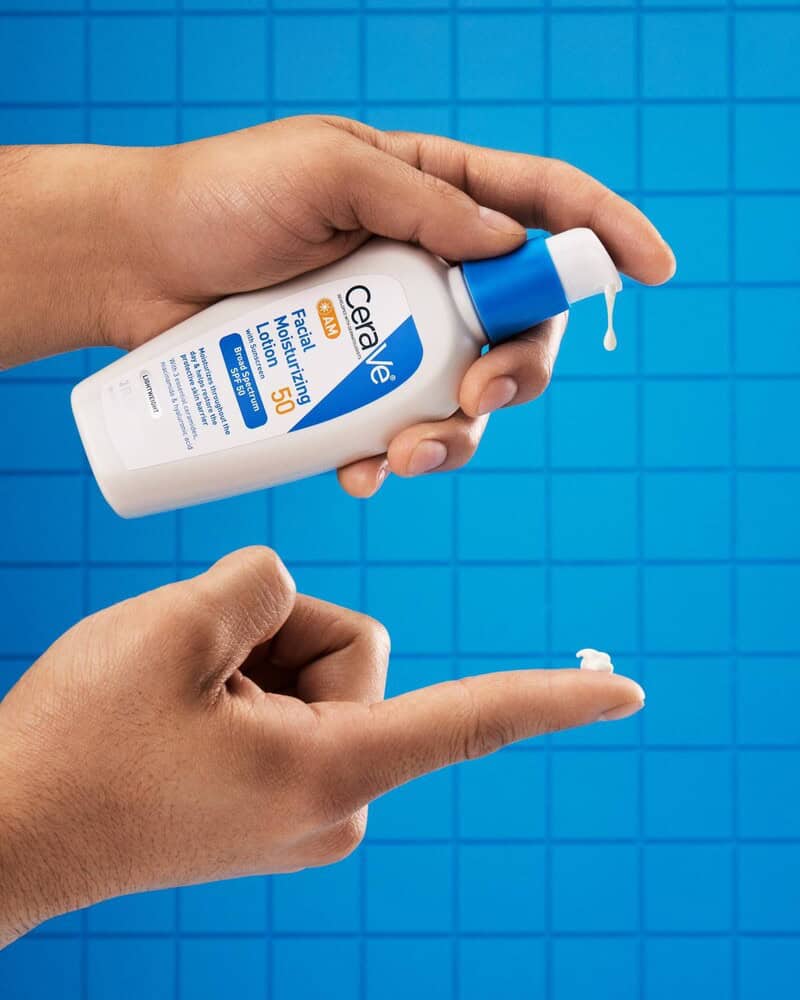 squeezing a drop of CeraVe Facial Moisturizing Lotion