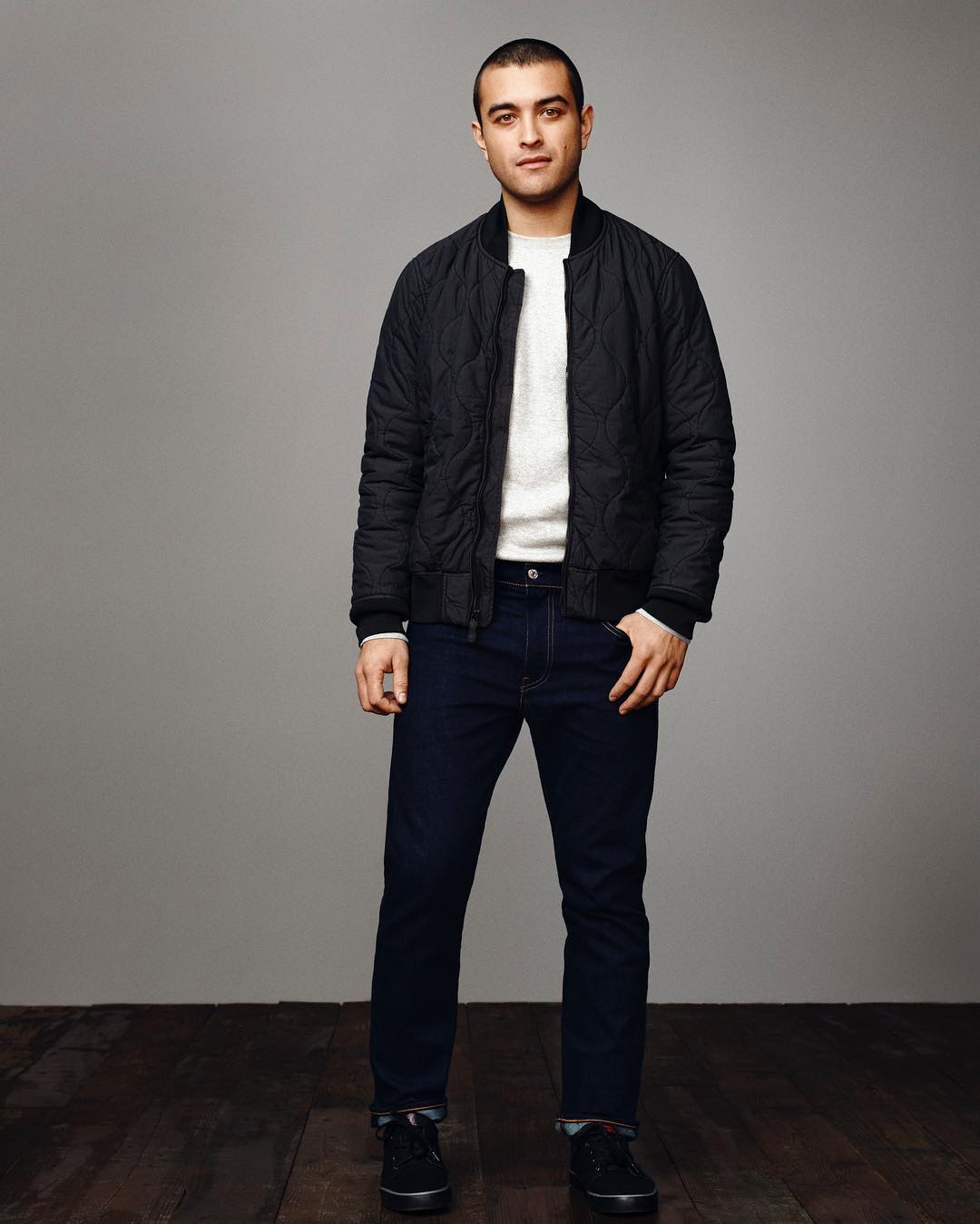 man wearing a black quilted by levis