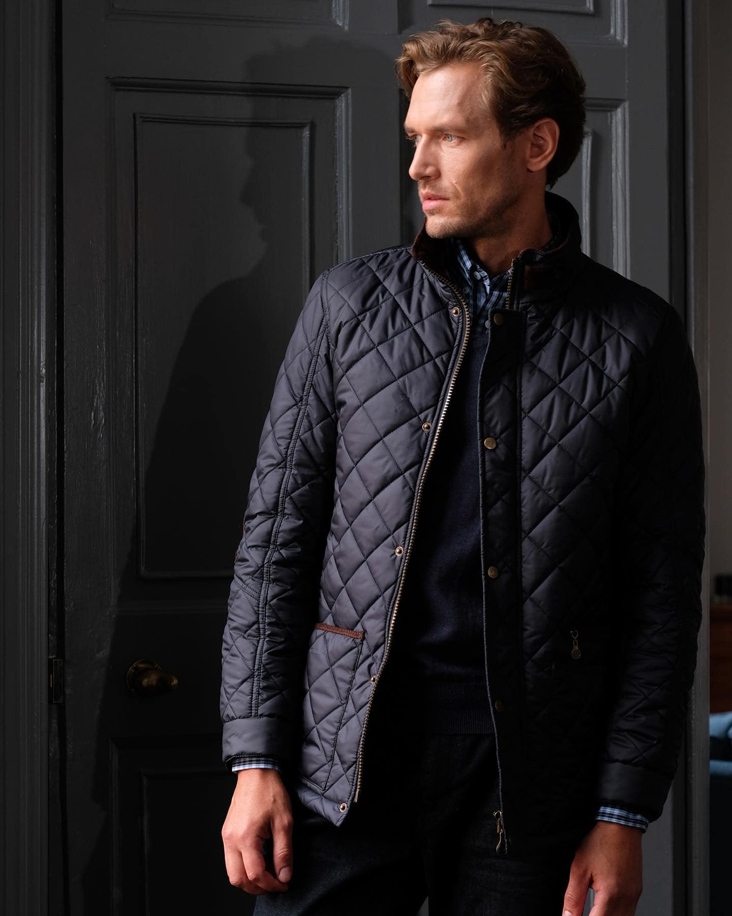 man wearing a black quilted jacket