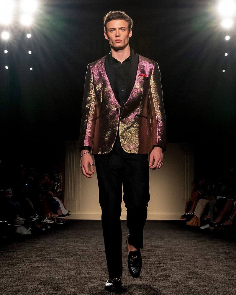 man wearing a rose gold tuxedo jacket